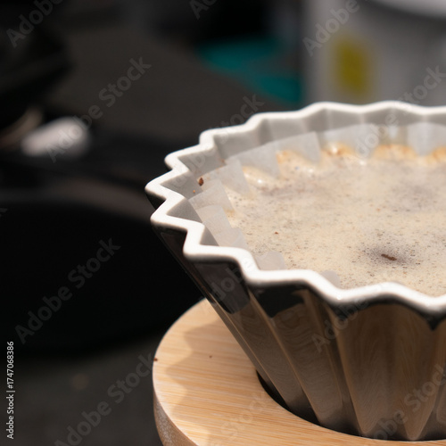 Coffee filter with ground coffee ready for brewing.