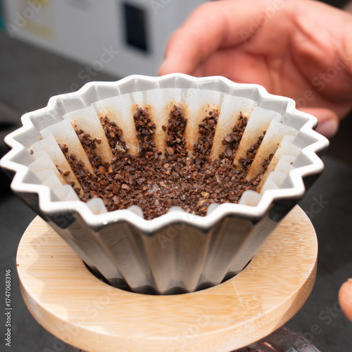 Coffee filter with ground coffee ready for brewing.