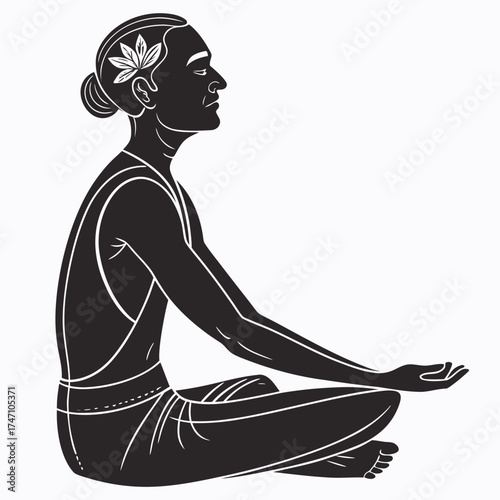 Black silhouette of person meditating in lotus pose with flower
