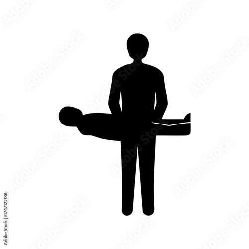 Silhouette of a physical therapist assisting a patient lying on a table