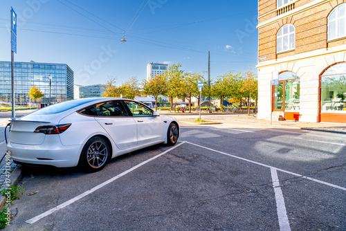 Canvas Print White electric car charges in Copenhagen