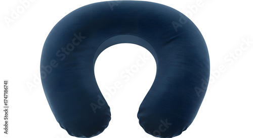 Dark blue memory foam travel pillow shows its shape on black. Great for product photography or advertising.