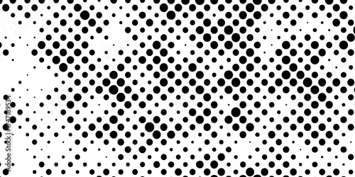 Abstract halftone pattern black dotted white background varying sized of black circles, dotted halftone gradient seamless pop art modern background of monochrome overlay design element.