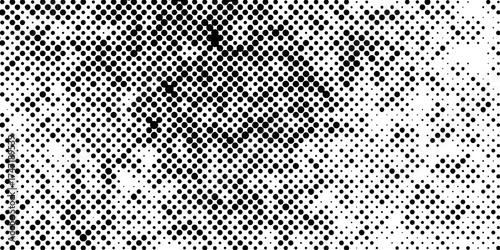 Abstract halftone pattern black dotted white background varying sized of black circles, dotted halftone gradient seamless pop art modern background of monochrome overlay design element.