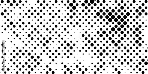 Abstract halftone pattern black dotted white background varying sized of black circles, dotted halftone gradient seamless pop art modern background of monochrome overlay design element.