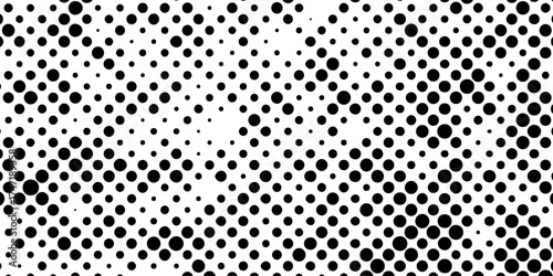 Abstract halftone pattern black dotted white background varying sized of black circles, dotted halftone gradient seamless pop art modern background of monochrome overlay design element.