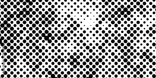 Abstract halftone pattern black dotted white background varying sized of black circles, dotted halftone gradient seamless pop art modern background of monochrome overlay design element.