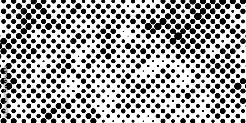 Abstract halftone pattern black dotted white background varying sized of black circles, dotted halftone gradient seamless pop art modern background of monochrome overlay design element.