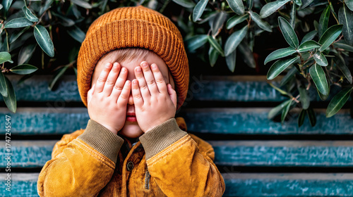 Cute Little Child Covering Eyes Outdoors in Autumn Clothes