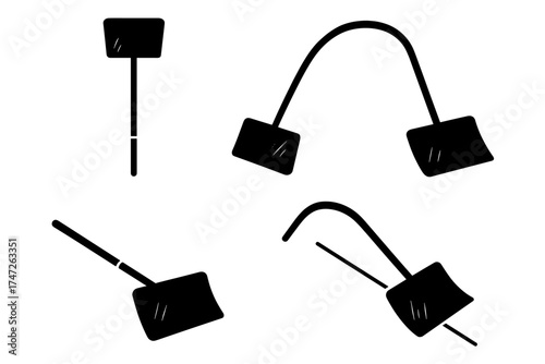 Set of black spatulas in various positions on white background