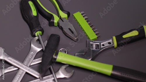 A set of building tools and instruments for repair in black and green colour. Must-have for men. Equipment for building. Repair tool kit. construction concept. gray background . High quality photo