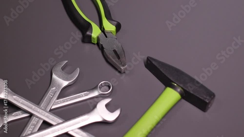 A set of building tools and instruments for repair in black and green colour. Must-have for men. Equipment for building. Repair tool kit. construction concept. gray background . High quality photo