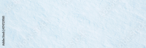 Natural snow texture. Smooth surface of clean fresh snow. Snowy ground. Wide panoramic winter background with snow patterns. Perfect for Christmas and New Year design. Closeup top view.
