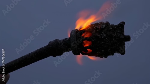 Burning torch at twilight