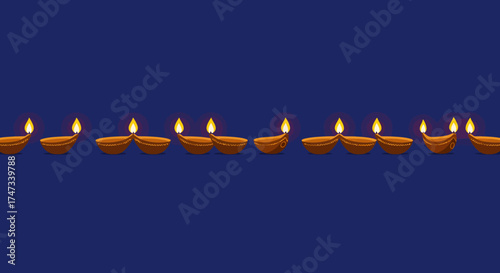 Line of lit clay lamps against a navy backdrop arranged in pairs and singles