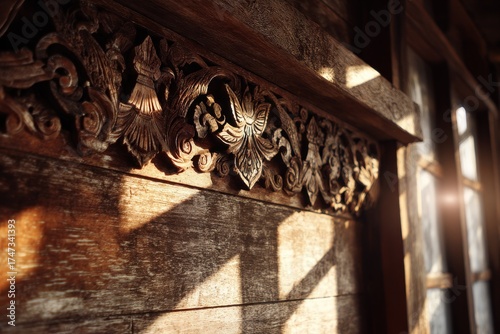 Intricate wooden carving detail on a rustic building facade