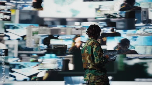 Wallpaper Mural Intelligence agency expert wearing camo uniform scanning enemy rockets using laptop. Military agent using radar systems on notebook program to detect incoming ballistic missiles, camera A Torontodigital.ca