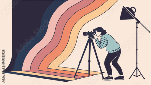 Photographer taking a photo with camera on tripod in studio with colorful backdrop.