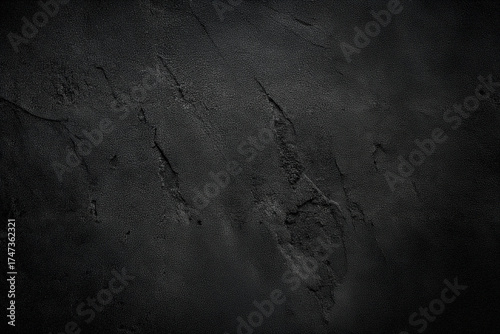 Black or dark gray rough grainy stone texture background