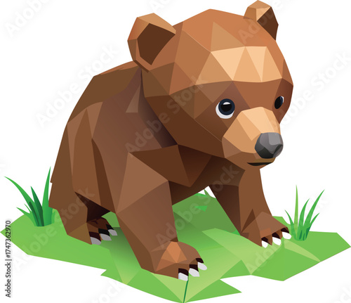 A brown bear sits calmly on green grass, surrounded by a natural outdoor setting.