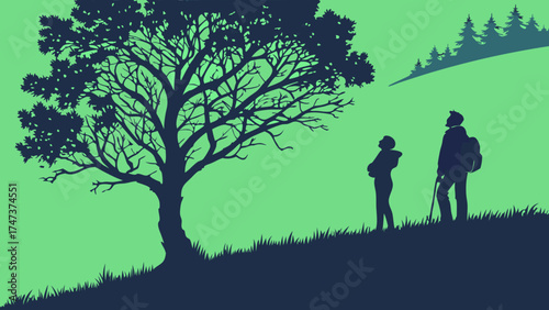 Silhouette of two hikers admiring nature landscape with a large tree and forest in the background.