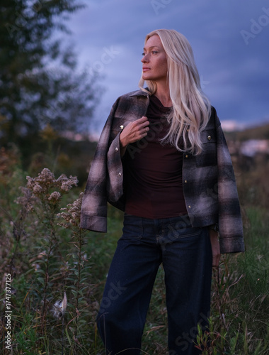 Golden Hour Serenity – Woman Enjoying a Warm Autumn Evening