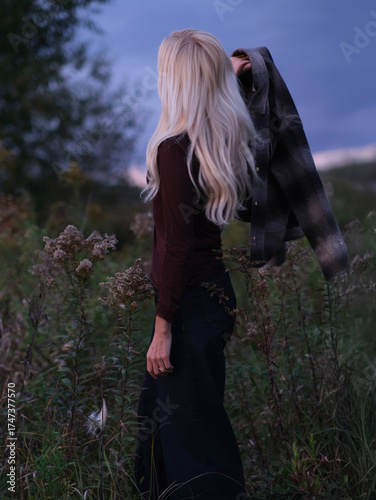 Golden Hour Serenity – Woman Enjoying a Warm Autumn Evening