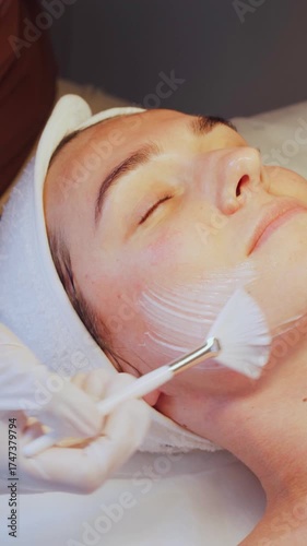 Cosmetologist performs a non-invasive carboxy therapy procedure on a patient in a beauty salon. Non-invasive carboxytherapy promotes rapid tissue healing, eliminates pigmentation, effects of acne.