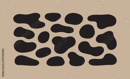 Black and white irregular spots pattern on beige background