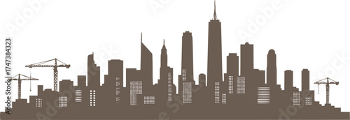 City skyline silhouette with cranes and skyscrapers at sunset — industrial urban growth and architecture background