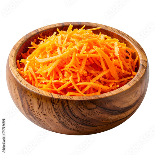 A wooden bowl brimming with shredded orange carrots. A close-up shot against black