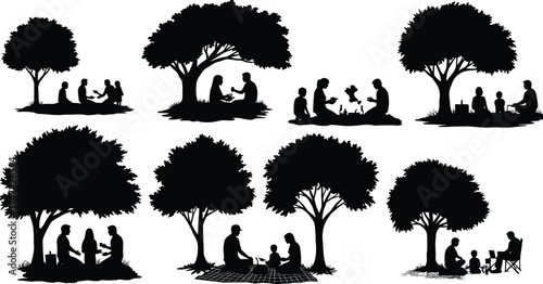 Silhouette family relaxing under trees in park, enjoying picnic together, parents and children spending peaceful outdoor leisure time