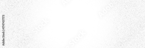 Stippled gradient texture. Fading grain dotted background. Sprayed grunge noise surface. Black dots, speckles, particles specks, dust, dots wallpaper. Subtle halftone gritty sand overlay.