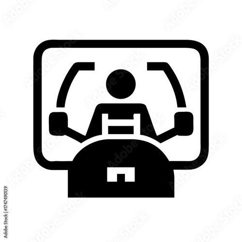 Silhouette of a person using a machine