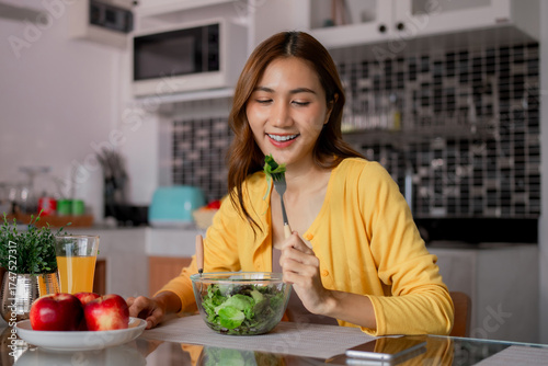 Photography Asian woman enjoy healthy fresh green salad vibrant kitchen home morning meal we