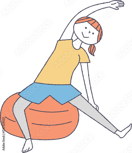 バランスボールでストレッチをする女性