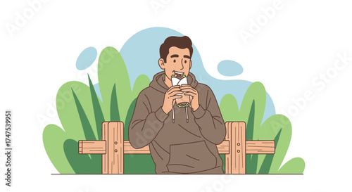 Man Eating Takeaway Food While Sitting On A Bench In The Park During The Daylight