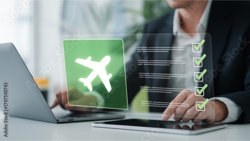 Businessman using a digital tablet and laptop to manage his travel plans, interacting with a virtual flight checklist for online booking and insurance