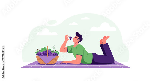 Man Reclining on Blanket, Sampling Cluster of Grapes next to Picnic Basket full of Fruit