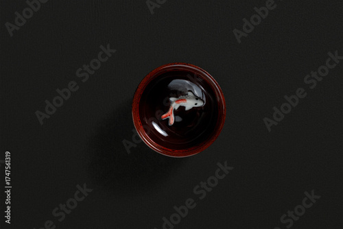 Sauce bowl on dark background