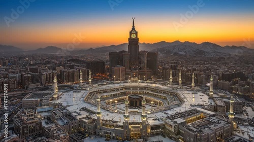 Aerial view of the grand mosque and abraj albait clock tower at sunset