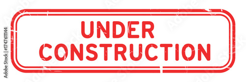 Red and white under construction sign with distressed texture
