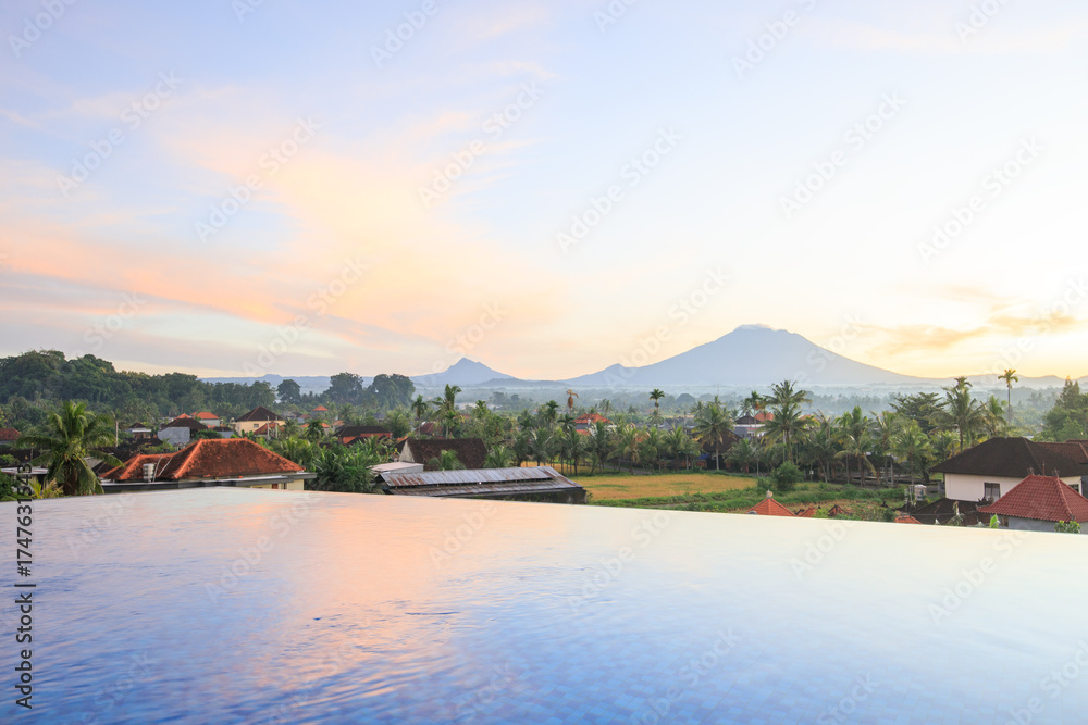 Obraz premium Beautiful view of a mountain range with a pool in the foreground