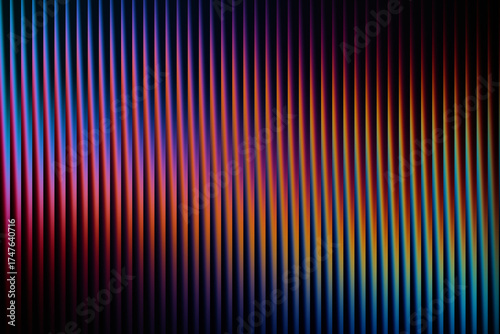 Striking abstract background with a vertical ribbed texture, showcasing a vibrant gradient of deep blue, purple, pink, orange, and yellow colors