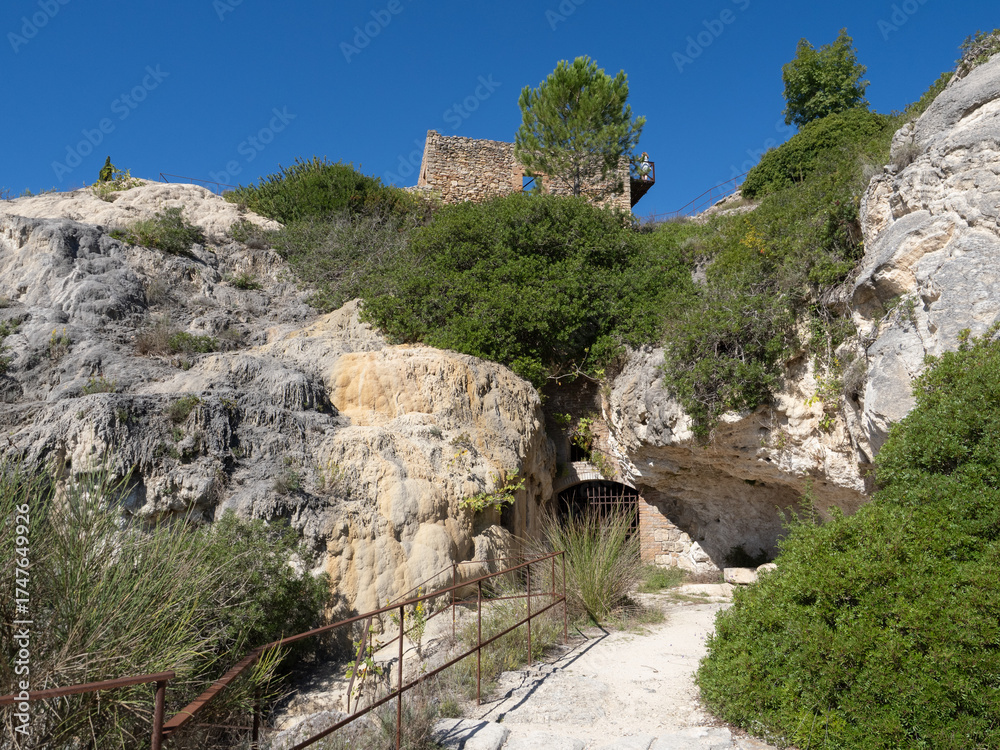 Obraz premium Parco naturale dei Mulini, public park with hot springs and dismantled system of grain mills at Bagno Vignoni, town in the province of Siena, Italy 