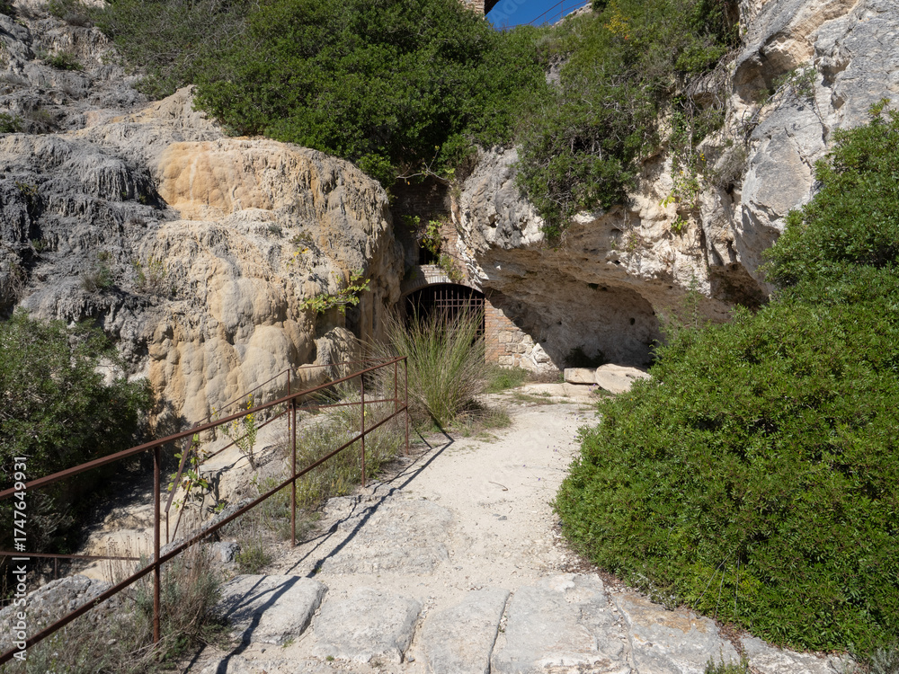 Fototapeta premium Parco naturale dei Mulini, public park with hot springs and dismantled system of grain mills at Bagno Vignoni, town in the province of Siena, Italy