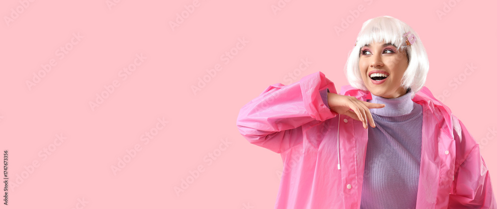 Fototapeta premium Beautiful young happy woman in white wig and raincoat on pink background