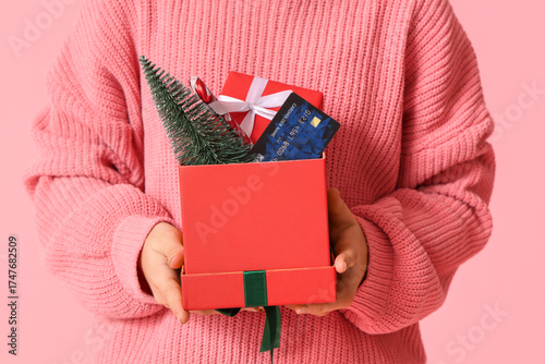 Girl with gift boxes, credi...