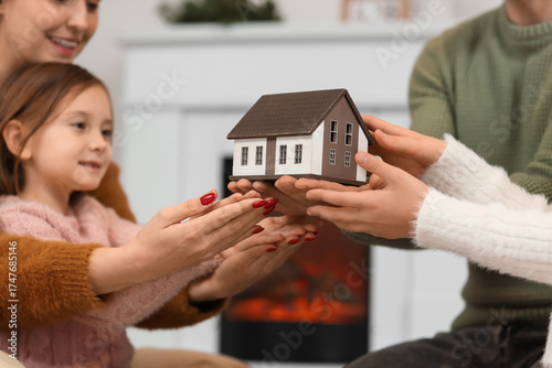 Young family with model of ...