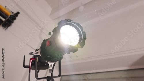 Large Studio Spotlight with Professional Lighting Setup for Photo or Video Shoot in Behind-the-Scenes Environment